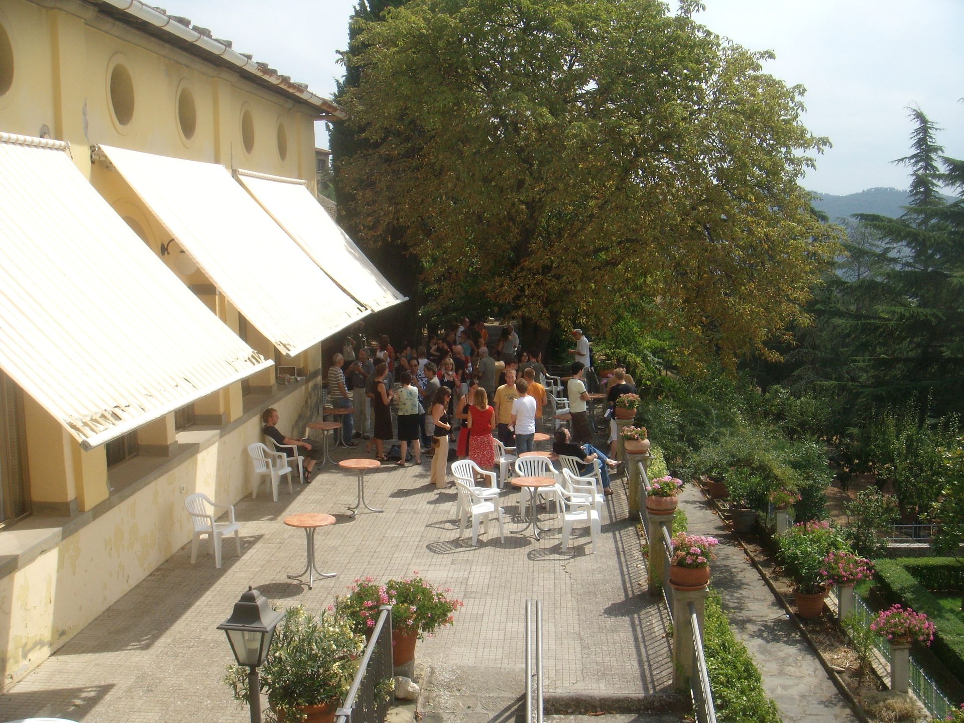 Participants working in several discussion circles outdoors at Cortona Week.